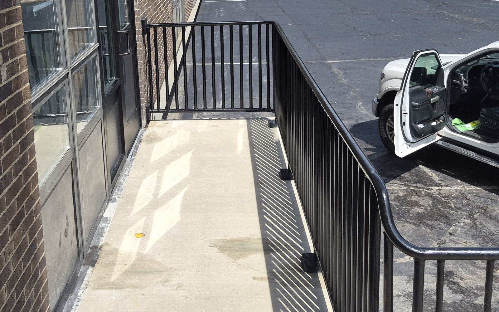 Installed black steel handrail on a commercial building