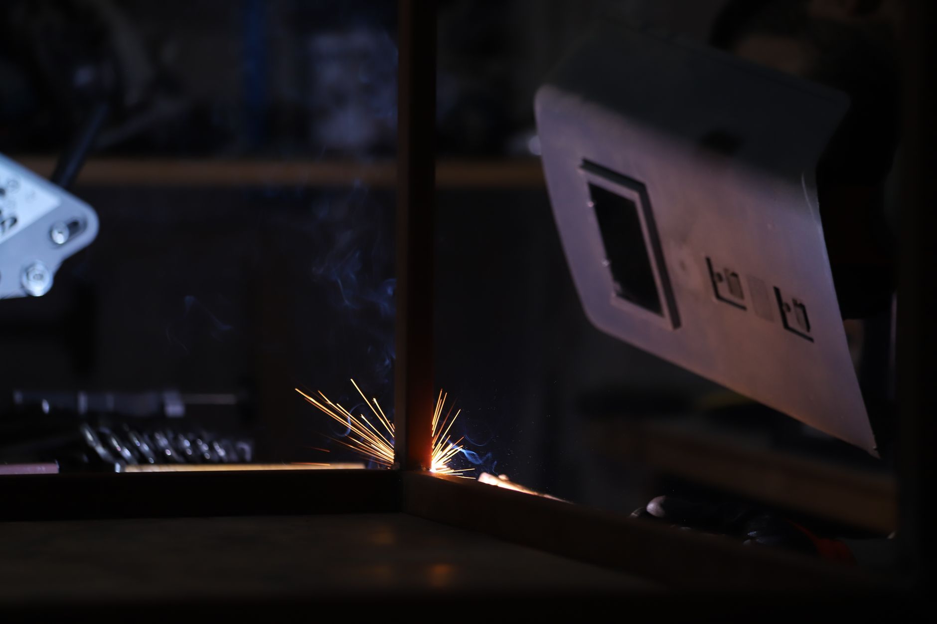 Welding at night in an industrial shop